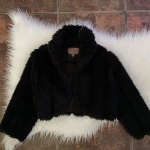 Adorable black fluffy fur coat.